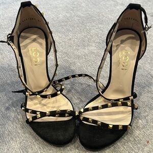 Lodi black heels with gold detailing.